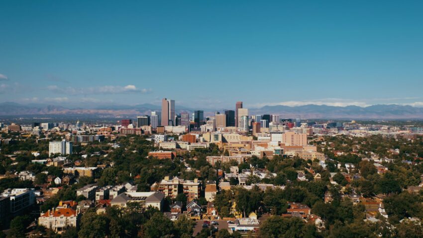 a view of the city with mountains in the background